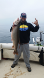 Capt Matt Strong with a laker using an Ice Strong Outdoors Laker Taker Lure