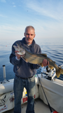 Gary Sutton with a laker using an Ice Strong Outdoors Laker Taker Lure