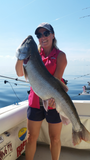 Laura Strong with a laker using an Ice Strong Outdoors Laker Taker Lure